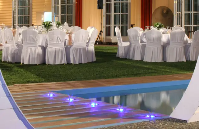Reception tables beside the pool
