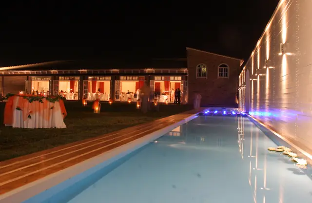 The illuminated pool of the estate at night