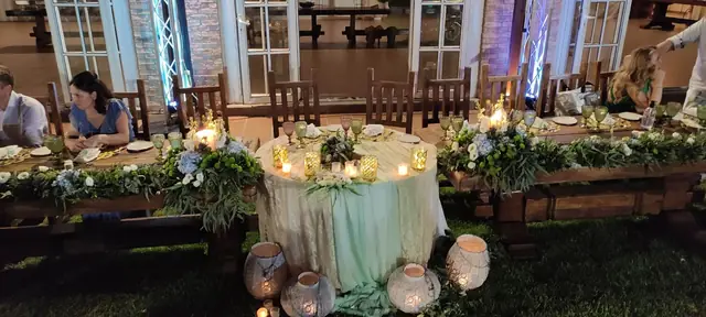 Head table decorated with flowers