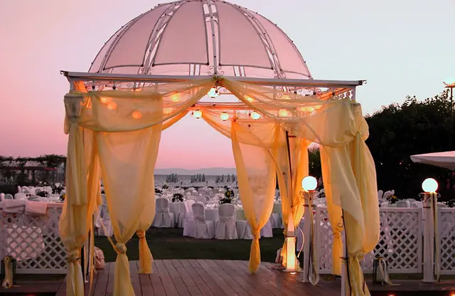 Decorated wedding gazebo at sunset