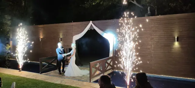 Bride and groom at the gazebo with fireworks