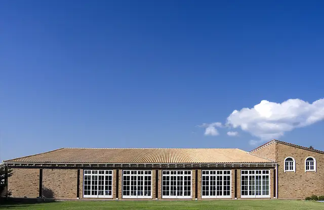 The reception estate in Varympompi under a blue sky