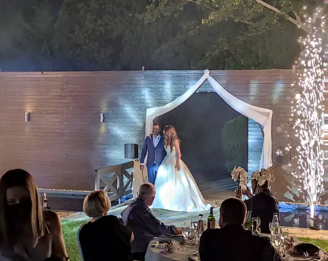 Couple at the gazebo with guests