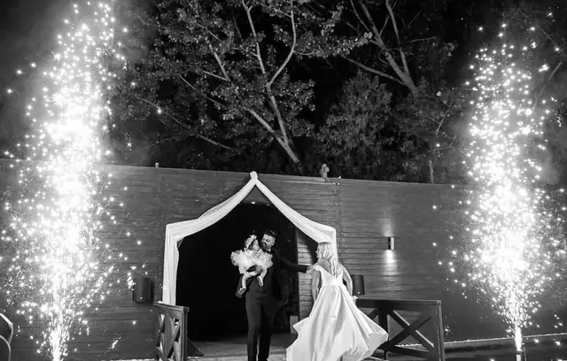 Bride and groom with fireworks, black and white