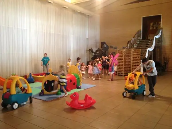 Kids' party with toys in the hall