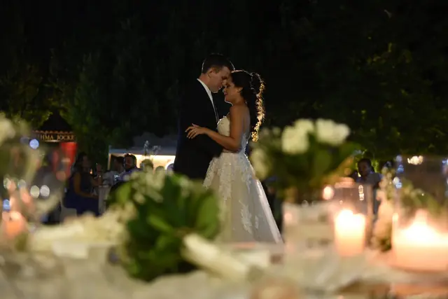 The couple's first dance among candles