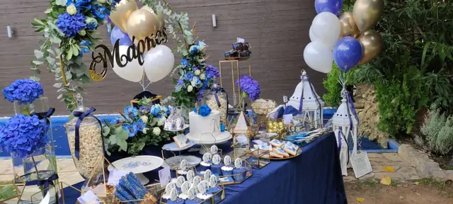 Baptism decoration with blue flowers and balloons