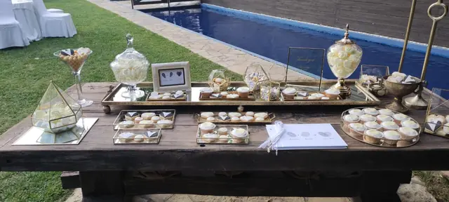 Sweets table by the pool at a wedding