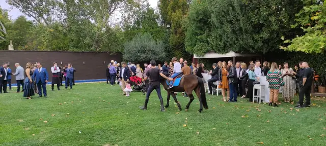 Pony ride for children at a baptism