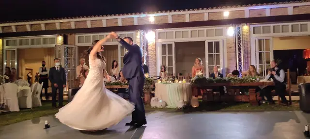 Bride and groom dancing in the garden