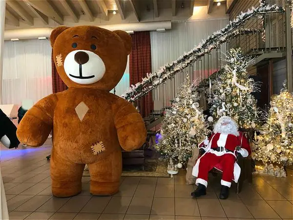 Christmas party with a teddy bear and Santa