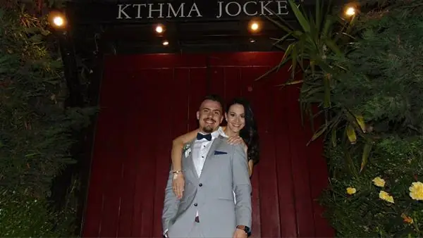 Couple at the estate's red door