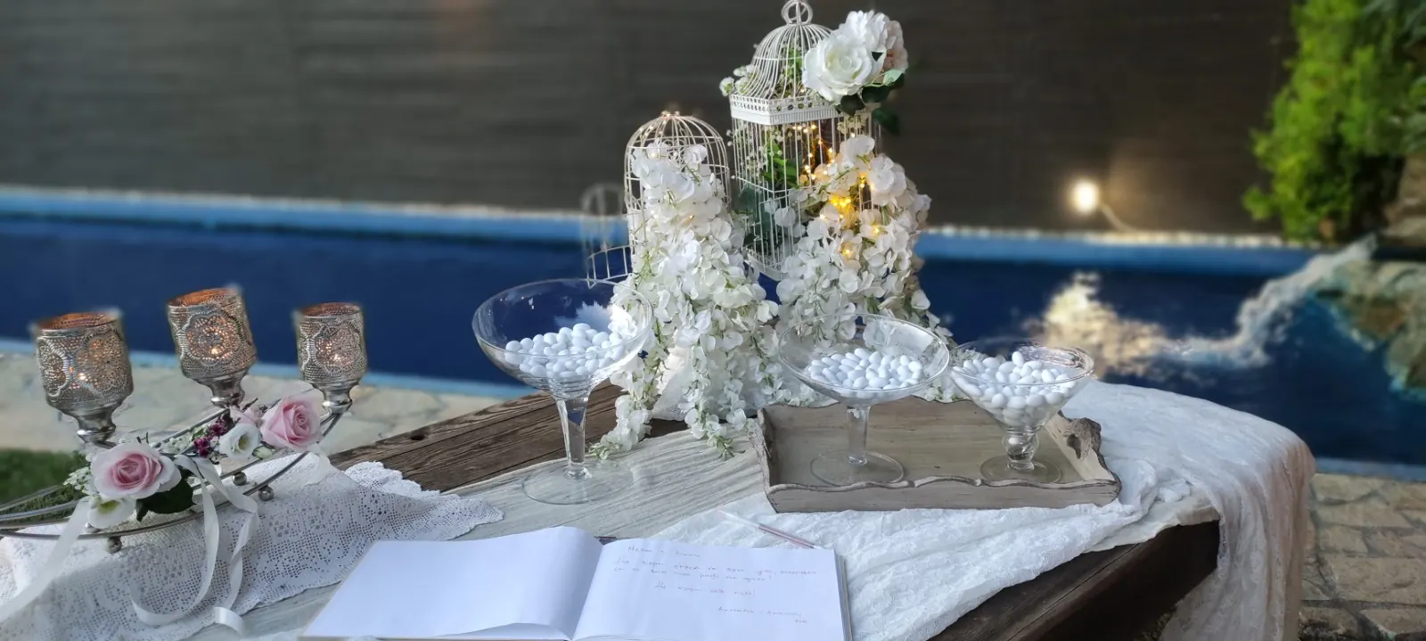 Decorated wishes table beside the pool